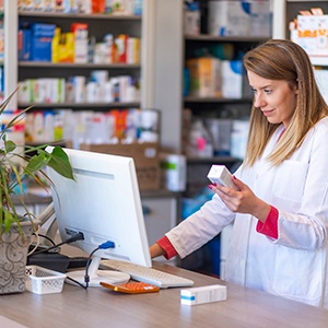 pharmacist filling a prescription