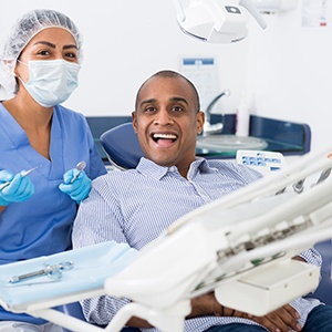 a relaxed and happy patient with a dental assistant